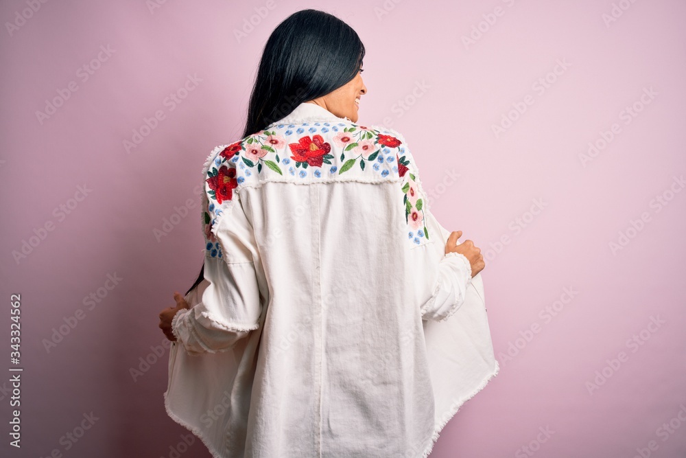 Young beautiful woman wearing fashion urban clothes, model wearing casual street style standing over pink background Young beautiful woman wearing fashion urban clothes, model wearing casual street style standing over pink background