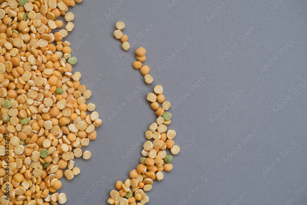 Dry peas beans close up on grey background. Healthy eating, useful beans. Dry peas beans close up on grey background. Healthy eating, useful beans.