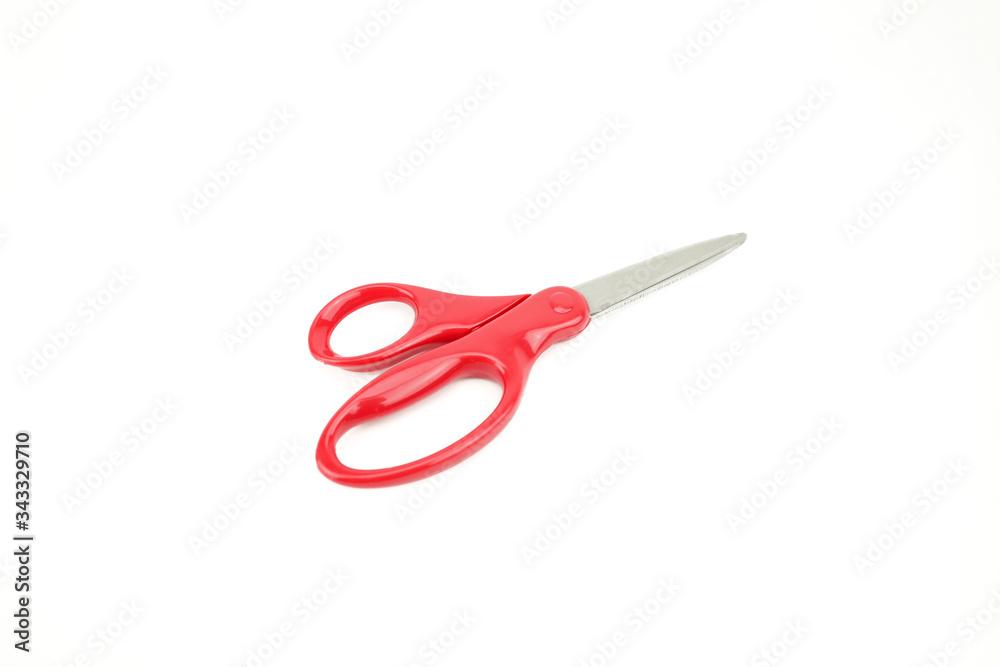 Red scissors isolated on white background. Close up with detail metal blades texture. Red scissors isolated on white background. Close up with detail metal blades texture.