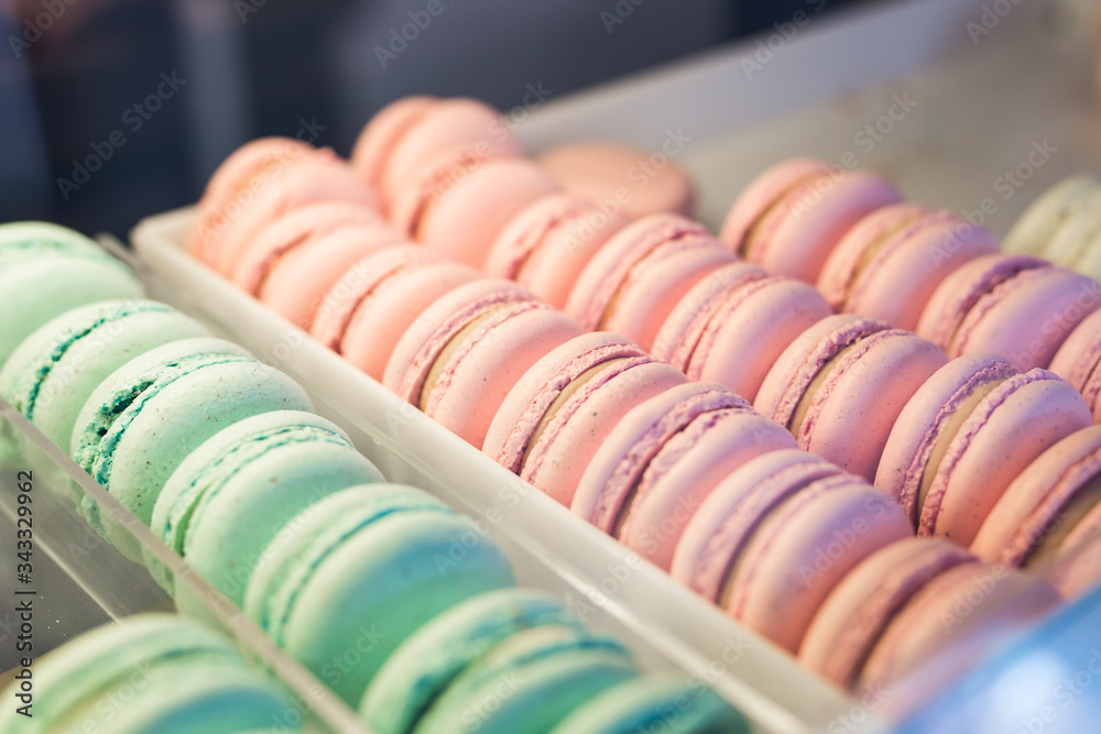 A french sweet delicacy, macaroons variety close-up on a showcase A french sweet delicacy, macaroons variety close-up on a showcase