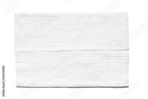 Wet wipe isolated on white background. Single clean desinfecting antibacterial towel folded top view photo