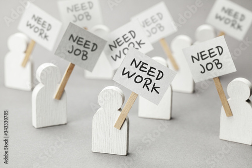 Need work. Crowd of unemployed people with posters on gray background