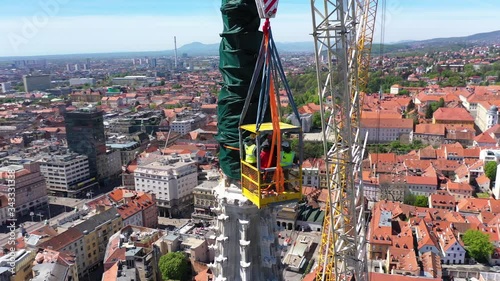 Zagreb Cathedral North Tower, damaged in Earthquake, preparing for controlled demolition by alpinists - Aerial Drone View photo
