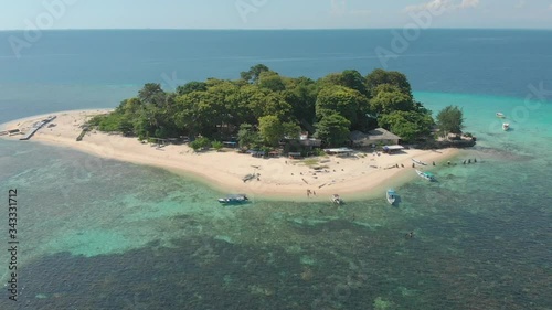 Aerial ascending on the amazing Samalona Island on the horizon, Makassar, Indonesia photo