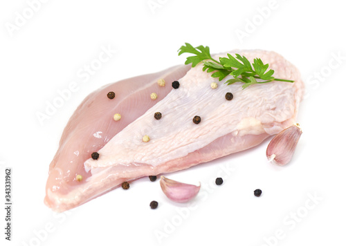 raw chicken breast with herbs and spices isolated on white background - Raw uncooked chicken meat marinated with ingredients for cooking food