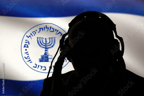 Quadro su tela Secret agent of the Israeli intelligence eavesdropping on conversations, spy and special agent, the Israeli flag of the special services