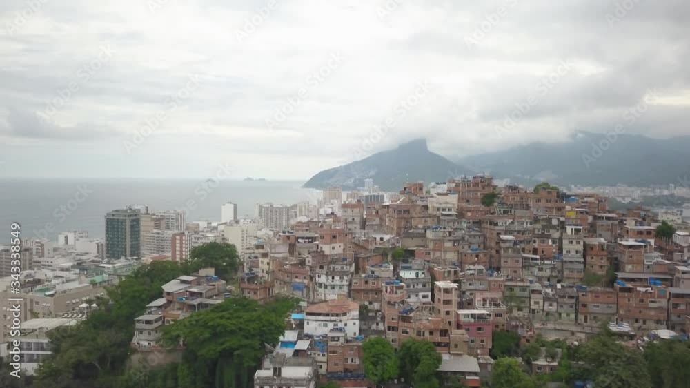 Drone arises over hillside favelas revealing the modern downtown of Rio de Janeiro, Brazil Drone arises over hillside favelas revealing the modern downtown of Rio de Janeiro, Brazil
