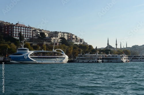 Passenger ships in the Bosphorus Strait at the Uksyudar Shehir Khatlary Isklesi Maritime Station on the Asian side of Istanbul photo