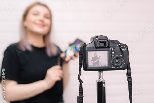 Beauty blogger (influencer) in front of the camera.