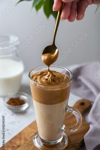 Spreading foam on a dalgon coffee spoon photo