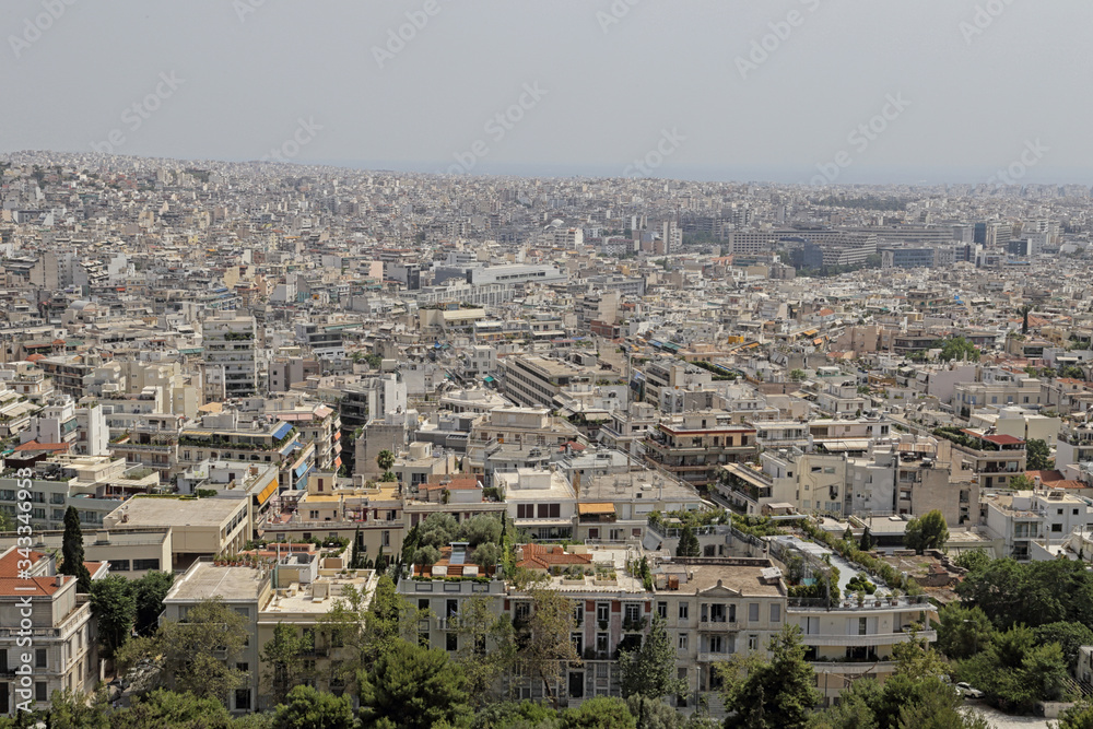 The Athens, Greece cityscape is shown looking southwest in the direction of the Athens Marina and Saronic Gulf.
