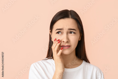 Portrait of sad young woman...
