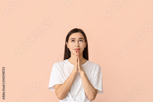 Portrait of praying young w...