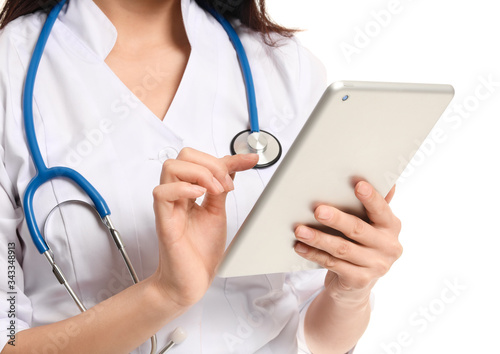 Female doctor with tablet computer on white background, closeup