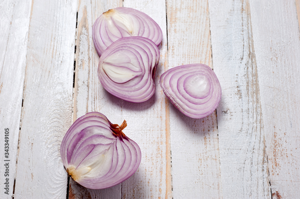 Red onion, lettuce. Health benefits, very rich in vitamins. Background for vegetables and garden plants and cooking. Red onion, lettuce. Health benefits, very rich in vitamins. Background for vegetables and garden plants and cooking.