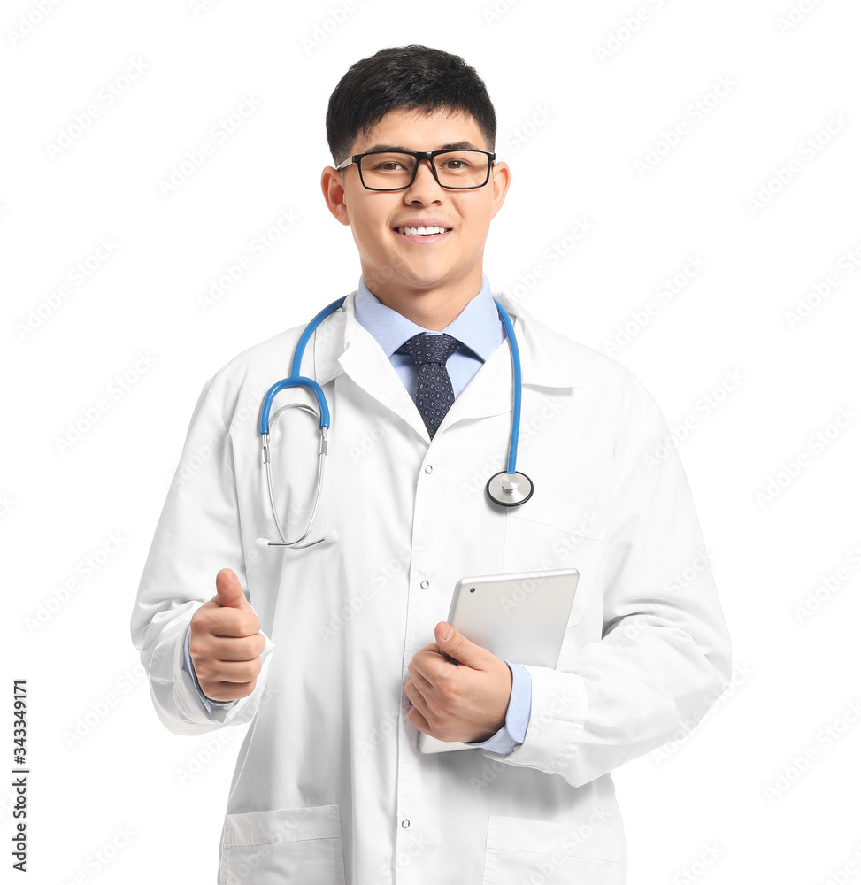 Male Asian doctor with tablet computer on white background