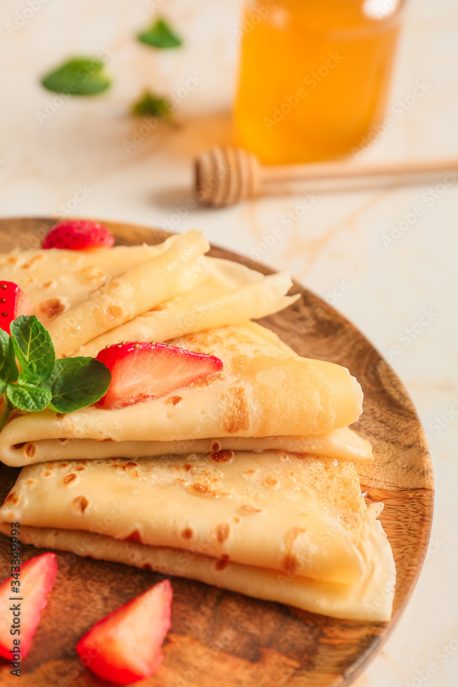 Plate with tasty blini and berries on table, closeup Plate with tasty blini and berries on table, closeup