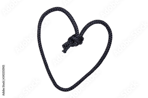 Rope isolated. Close-up of black node or knot in the shape of a heart isolated on a white background. Concept valentine, wedding or navy and angler knot.