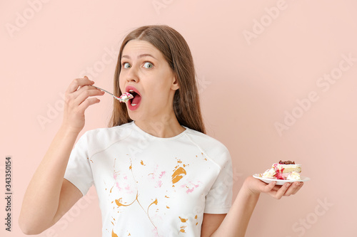 Woman in dirty clothes eati...
