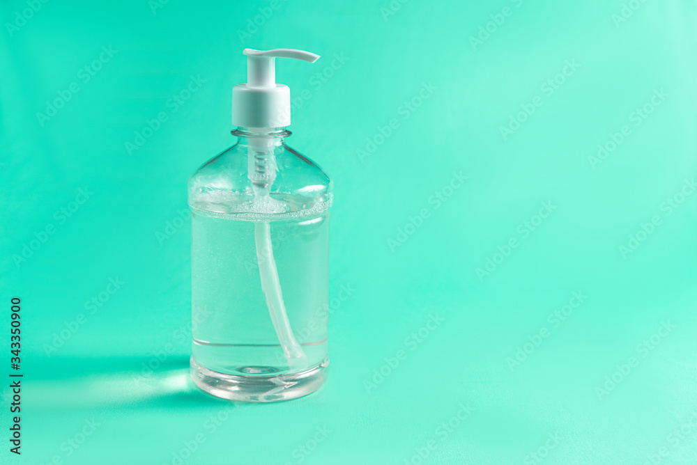 Container with alcohol gel on the light blue background Container with alcohol gel on the light blue background