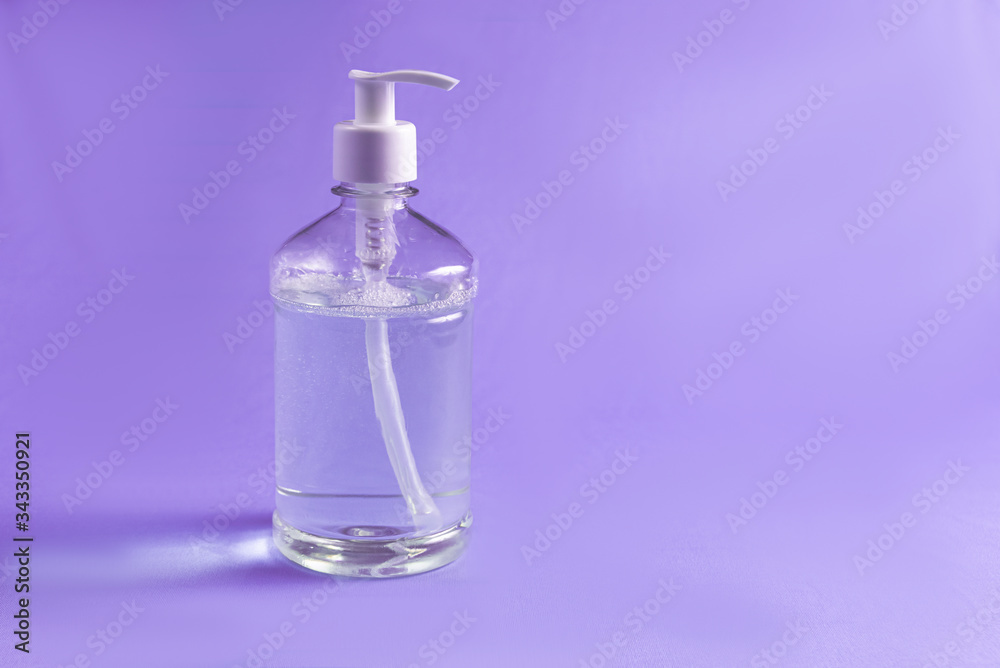 Container with alcohol gel on the light blue background Container with alcohol gel on the light blue background