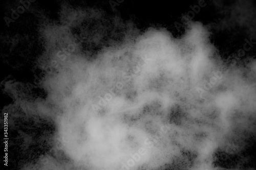 white powder explosion on Black background. Colorful dust explode. Paint Holi.