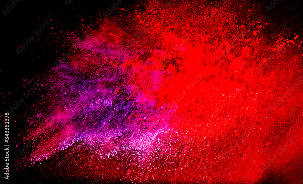 Colorful powder explosion on black background. Colorful dust explode. Paint Holi.