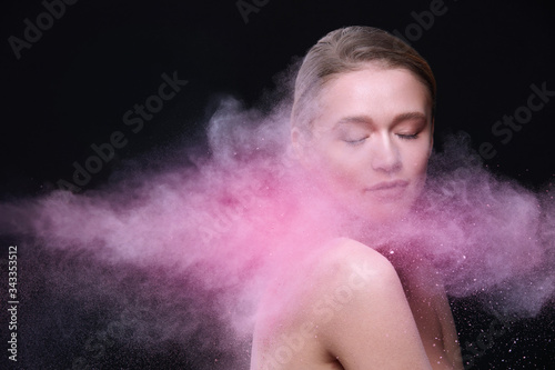 Beauty Products And Makeup Cosmetics. Beautiful Female Model Posing With Flying Pink Blush Powder On Face And Body. Fashionable Sexy Young Woman In Colored Cloud Of Cosmetic Powder. High Resolution