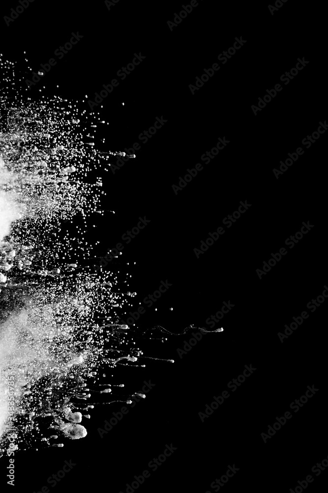 Obraz premium Abstract art powder paint on black background. Movement abstract frozen dust explosion multicolored on black background.