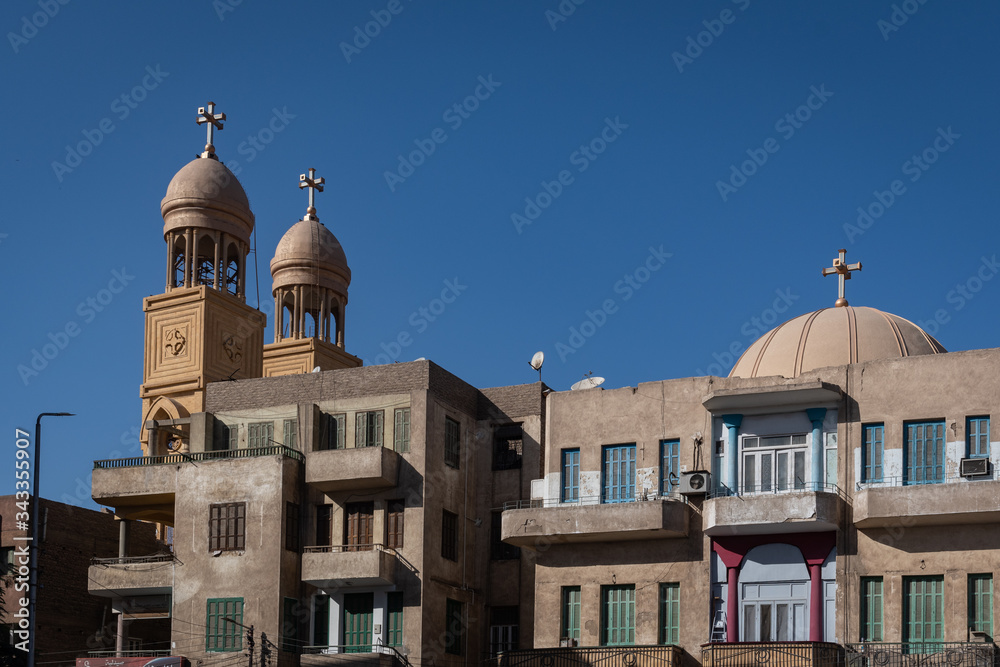The Michael Angel Church among buildings in Luxor, Egypt