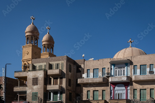 The Michael Angel Church among buildings in Luxor, Egypt photo