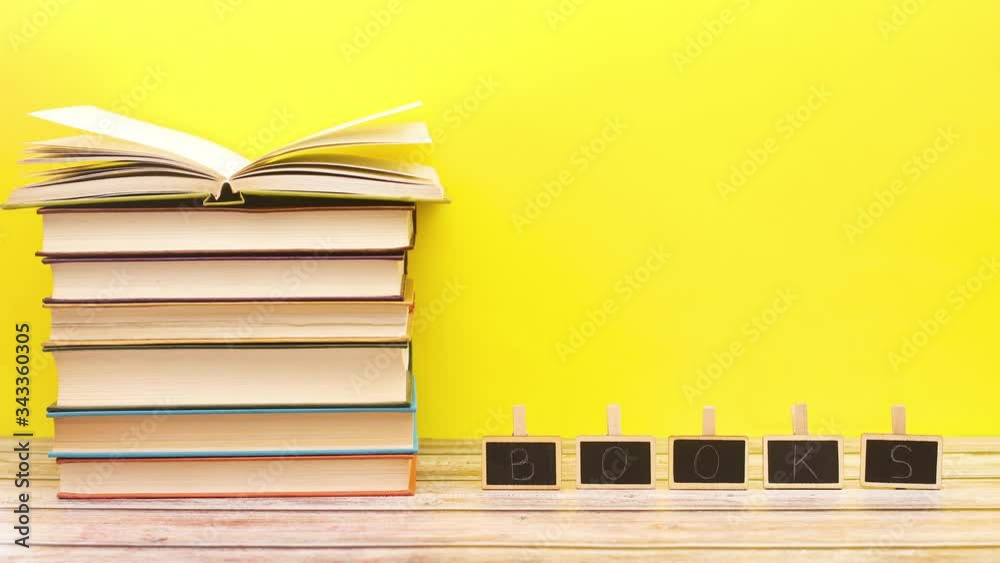 Books title appear on table with ordered books - Stop motion Books title appear on table with ordered books - Stop motion