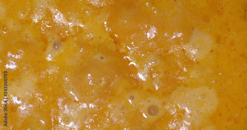 Cheese fondue is boiling with air bubbles. Cheese fondue is boiling with air bubbles.