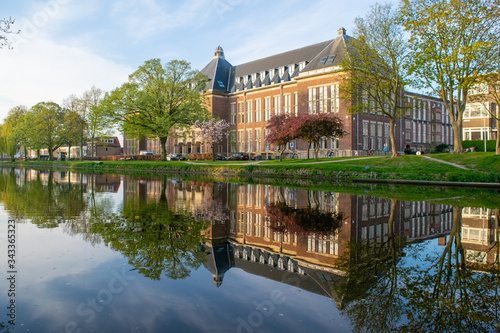The old library in the city of Delft viewed from the canal.