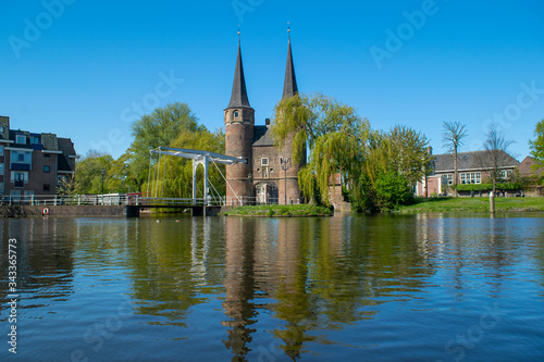 A view from the canal of the Oostpoort (east gate) in the city of Delft.