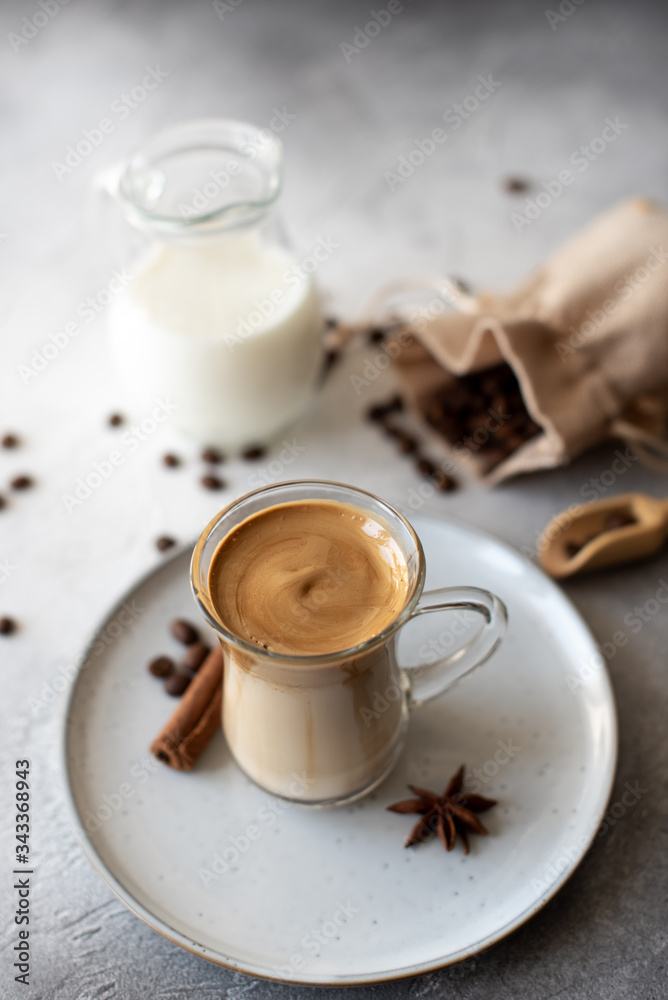Dalgona coffee. Iced fluffy creamy whipped trend drink with coffee foam and milk. Trendy drink during Covid-19 city lock down and self quarantine, stay at home concept. Dalgona coffee. Iced fluffy creamy whipped trend drink with coffee foam and milk. Trendy drink during Covid-19 city lock down and self quarantine, stay at home concept.