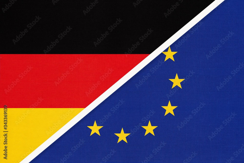 Federal Republic of Germany vs European Union or EU national flag from textile. Symbol of the Council of Europe. Federal Republic of Germany vs European Union or EU national flag from textile. Symbol of the Council of Europe.