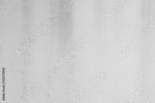 White concrete wall with black stains as background © Worklike