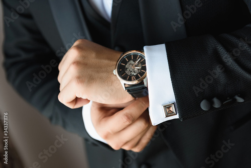 Businessman adjusts his suit before the meeting