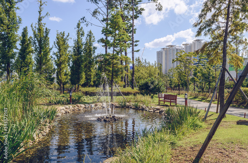 clean pond and small fountain in Busan citizens park