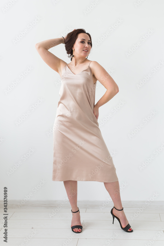 Fashion photo of young lady in elegant evening dress on white background. Fashion photo of young lady in elegant evening dress on white background.