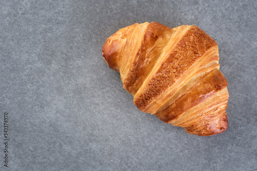 Croissant on a gray background.