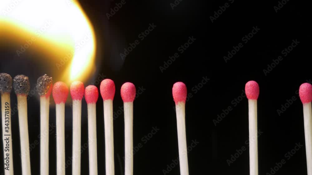 Close Up of wax matches burning on black background. Social Distancing Concept Close Up of wax matches burning on black background. Social Distancing Concept
