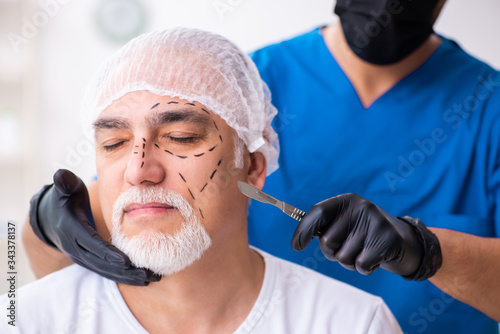Old man visiting male doctor for plastic surgery