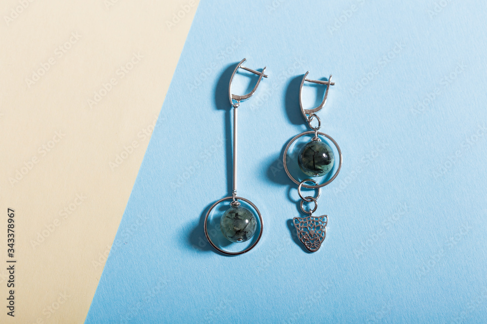 Top view of fashion jewelry and accessories on bright color background. Luxurious jewelry bijouterie and trendy concept. Top view of fashion jewelry and accessories on bright color background. Luxurious jewelry bijouterie and trendy concept.
