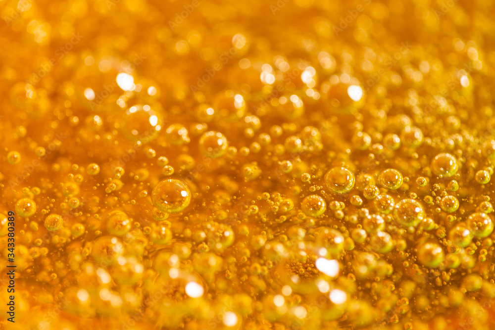 Depilation and beauty concept - close-up of sugar paste or honey wax for hair removing. Macro photo Depilation and beauty concept - close-up of sugar paste or honey wax for hair removing. Macro photo