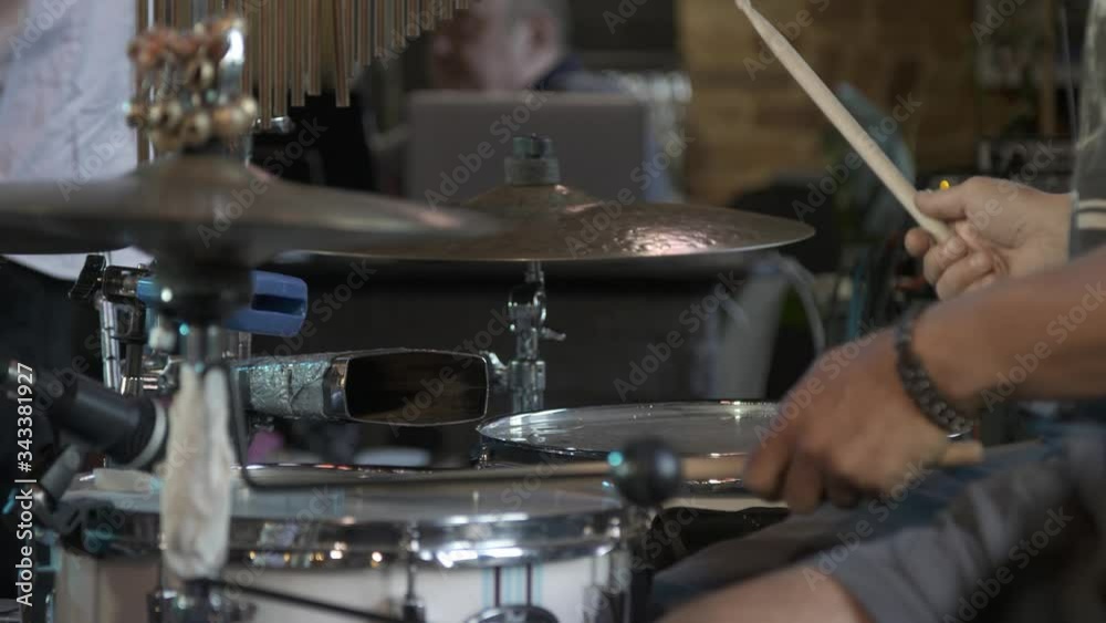 Drummer playing drums, hands with chopsticks. Detail. Drummer playing drums, hands with chopsticks. Detail.