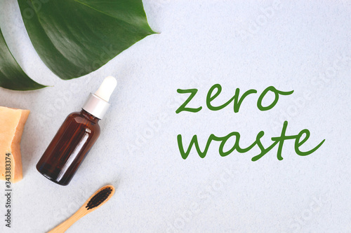 The concept of zero waste. bamboo toothbrush, solid shampoo and serum photo