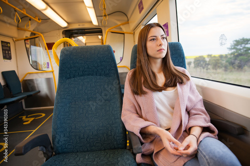 Young Woman Sitting Alone on the Train