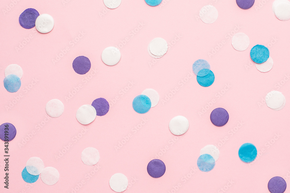 Blue, white and lilac confetti on pink color paper background minimal style Blue, white and lilac confetti on pink color paper background minimal style